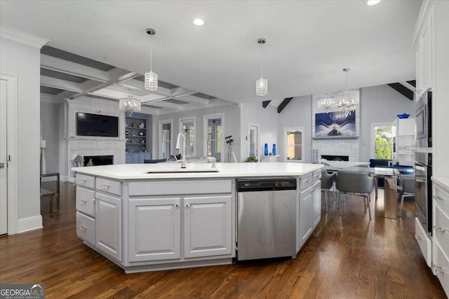 109 Slate Dr, Buford, GA 30518 - kitchen featuring a large fireplace, open floor plan, stainless steel appliances, a sink, and a chandelier