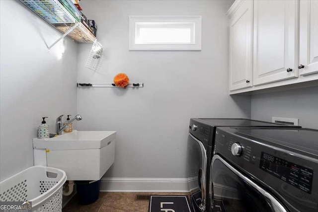 109 Slate Dr, Buford, GA 30518 - laundry area with cabinet space, washing machine and clothes dryer, and baseboards