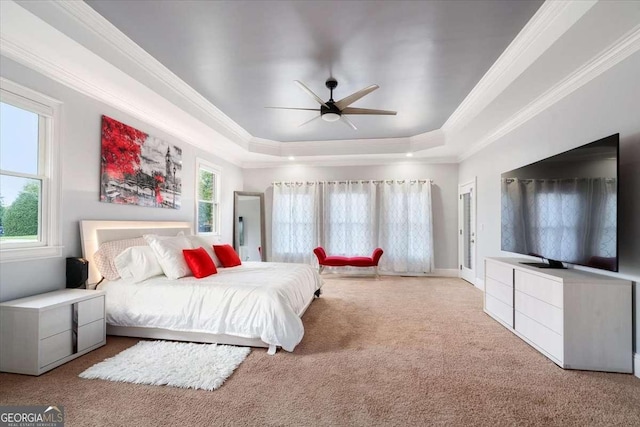 109 Slate Dr, Buford, GA 30518 - carpeted bedroom featuring a raised ceiling, ornamental molding, baseboards, and ceiling fan