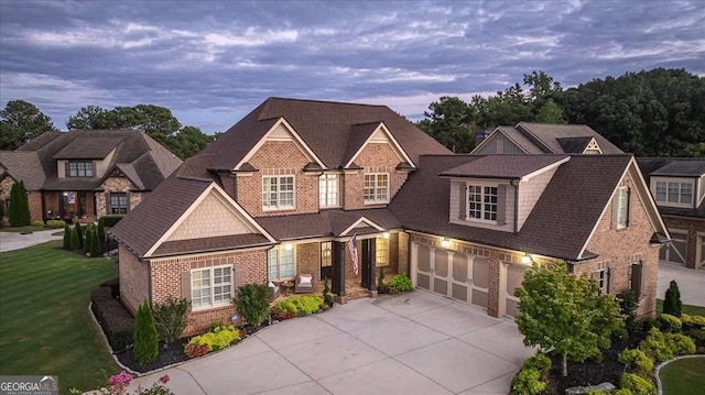 109 Slate Dr, Buford, GA 30518 - view of front of property featuring brick siding, driveway, a garage, roof with shingles, and a front yard