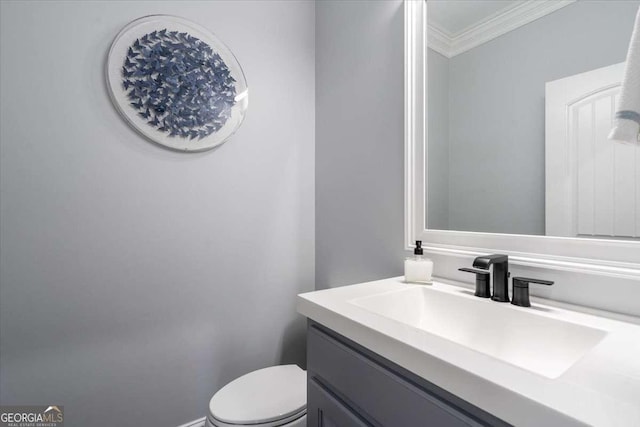 109 Slate Dr, Buford, GA 30518 - half bathroom with vanity, crown molding, and toilet
