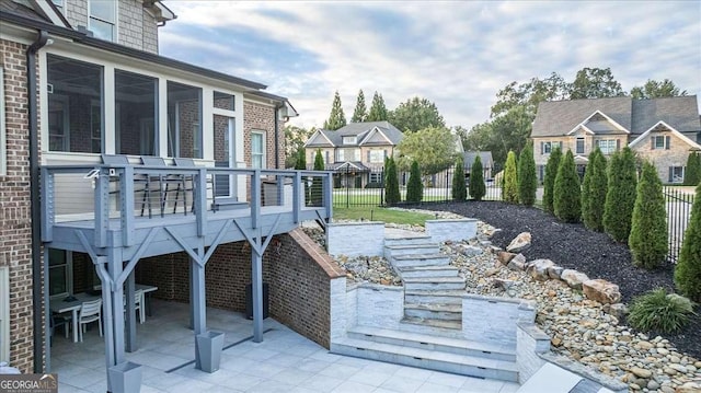 109 Slate Dr, Buford, GA 30518 - view of patio with a residential view, a deck, and a sunroom