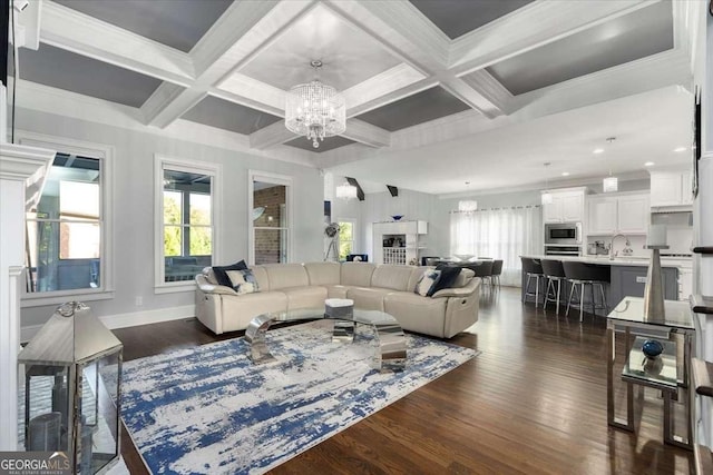 109 Slate Dr, Buford, GA 30518 - living area with a chandelier, dark wood-style flooring, beam ceiling, coffered ceiling, and baseboards