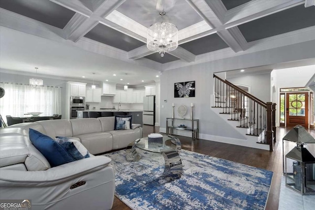 109 Slate Dr, Buford, GA 30518 - living room featuring a chandelier, stairs, coffered ceiling, baseboards, and beamed ceiling