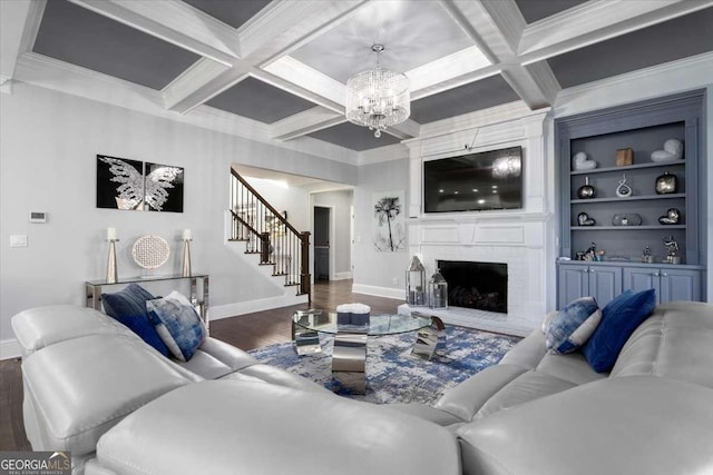 109 Slate Dr, Buford, GA 30518 - living area with baseboards, a chandelier, wood finished floors, stairs, and crown molding