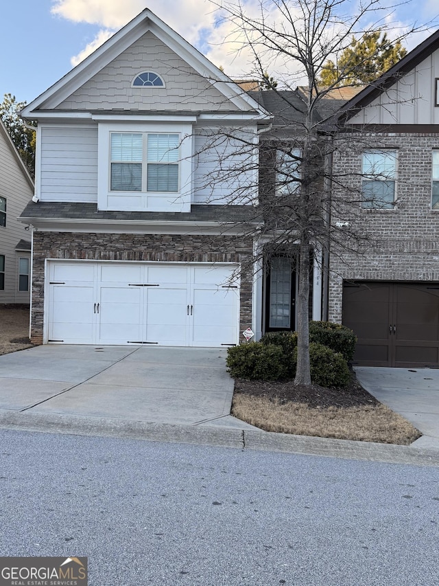 3144 Spicy Cedar Ln, Lithonia, GA 30038 - view of front facade with stone siding, concrete driveway, and a garage