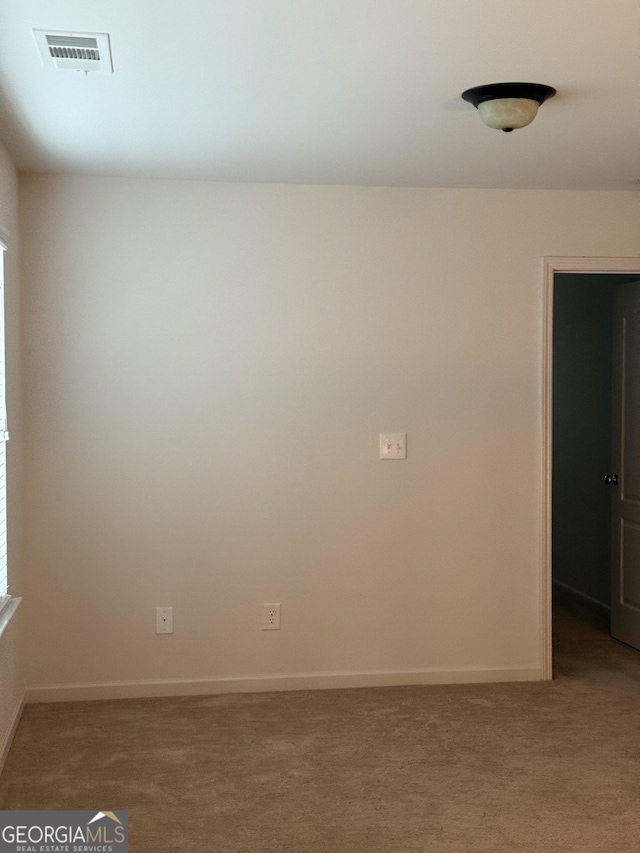 view of carpeted spare room