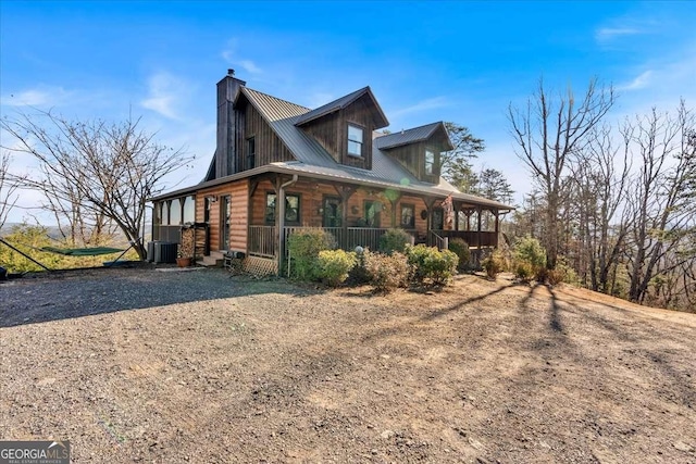 view of home's exterior featuring central AC and covered porch