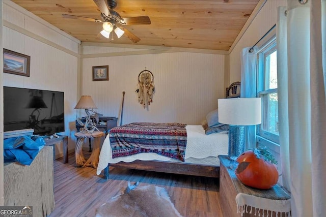 bedroom featuring hardwood / wood-style floors, wood ceiling, vaulted ceiling, and ceiling fan