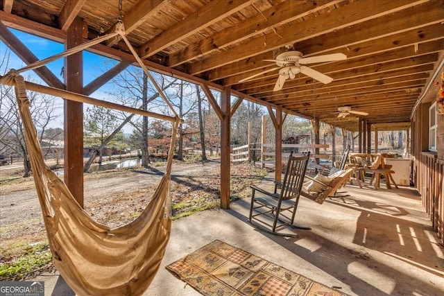 exterior space featuring ceiling fan