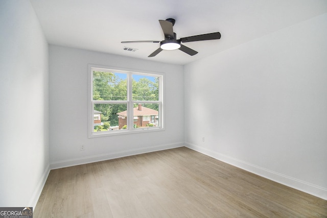 spare room with ceiling fan and light hardwood / wood-style floors