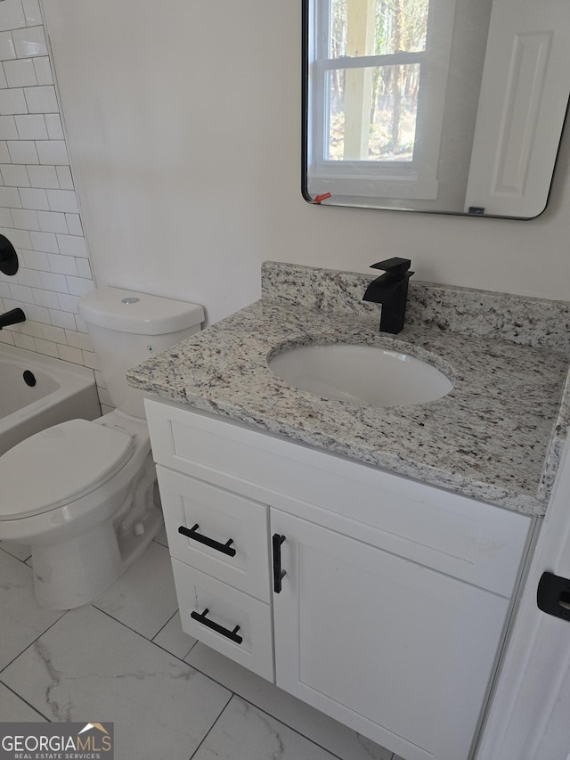 full bathroom featuring shower / bath combination, vanity, and toilet