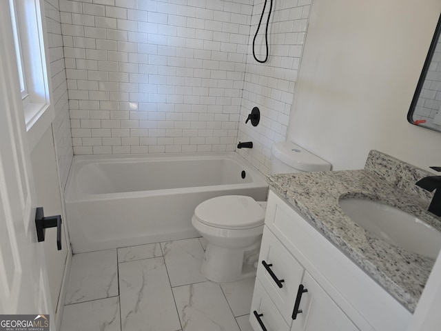 full bathroom with tiled shower / bath combo, vanity, and toilet