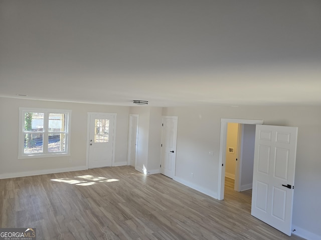 entryway with light hardwood / wood-style floors