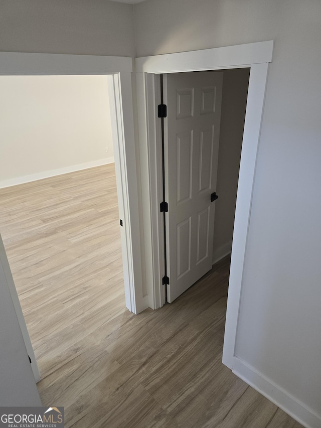 hallway featuring light hardwood / wood-style flooring