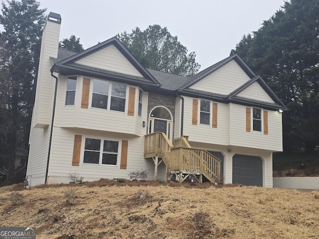 split foyer home featuring a garage