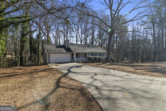 ranch-style house featuring a garage