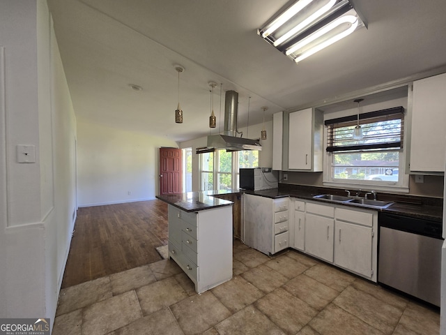 kitchen featuring sink, white cabinets, island exhaust hood, stainless steel dishwasher, and kitchen peninsula