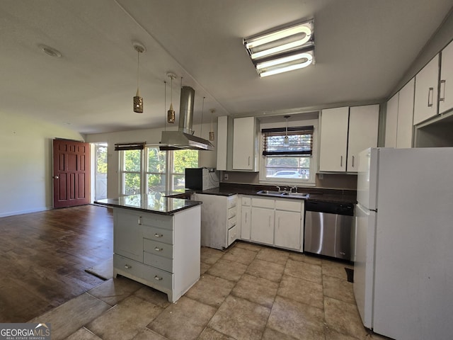 kitchen featuring white cabinetry, stainless steel dishwasher, kitchen peninsula, and white fridge