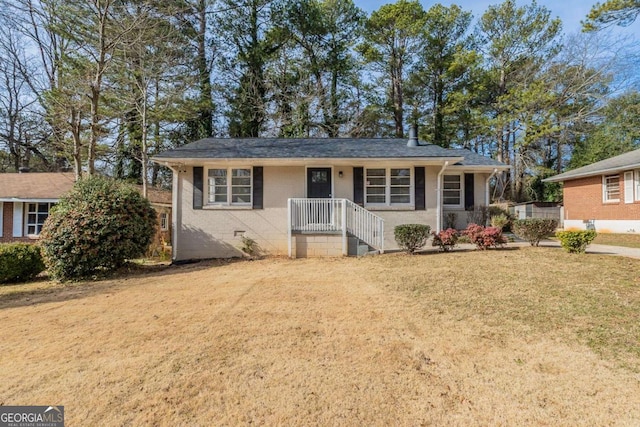 ranch-style home with a front yard