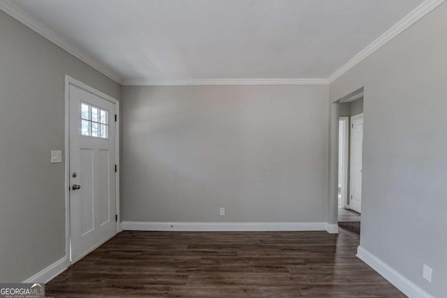 foyer entrance with dark hardwood / wood-style flooring and crown molding