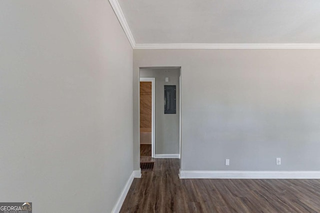 unfurnished room with dark hardwood / wood-style flooring and crown molding