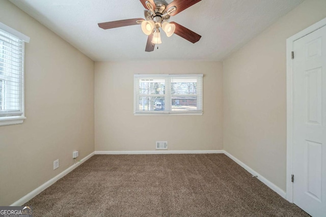 unfurnished room with carpet floors and ceiling fan