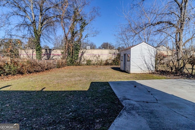 view of yard with a shed and a patio