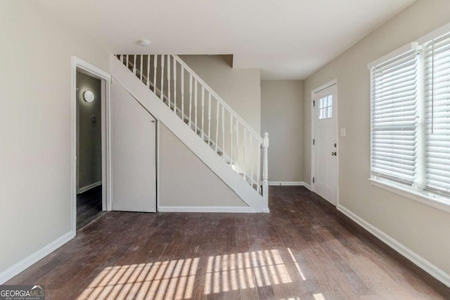 foyer entrance with dark hardwood / wood-style flooring