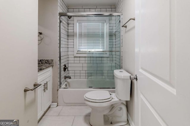 full bathroom with vanity, tile patterned floors, shower / bath combination with glass door, and toilet