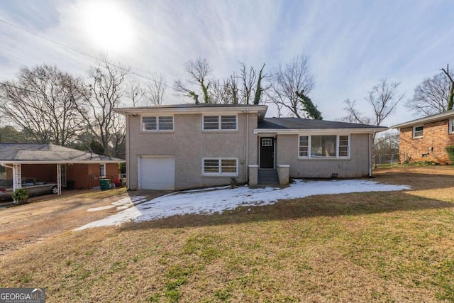 split level home featuring a garage and a front lawn