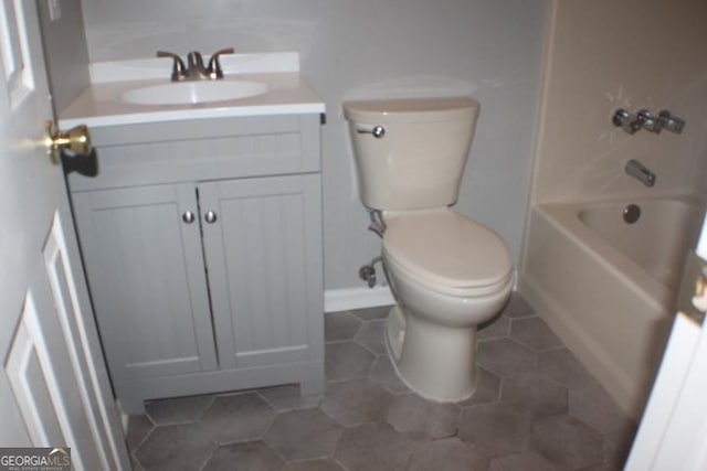 full bathroom featuring vanity, toilet,  shower combination, and tile patterned flooring