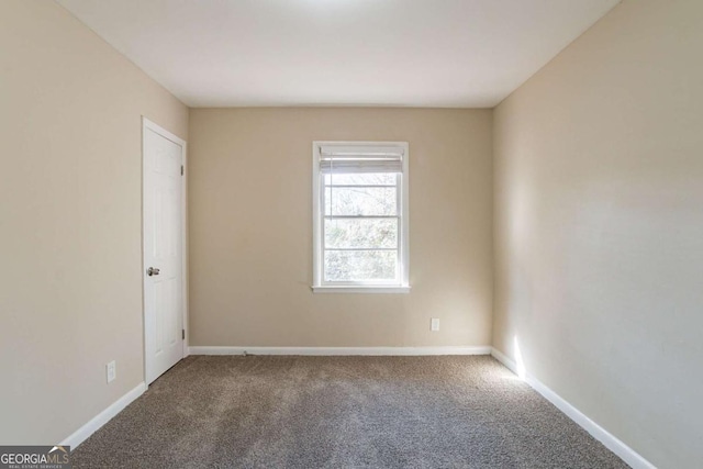 unfurnished room featuring carpet flooring