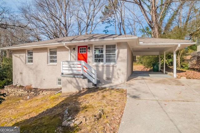 view of front of home with a carport