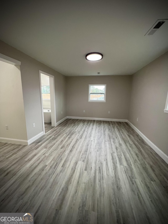 unfurnished room featuring hardwood / wood-style floors