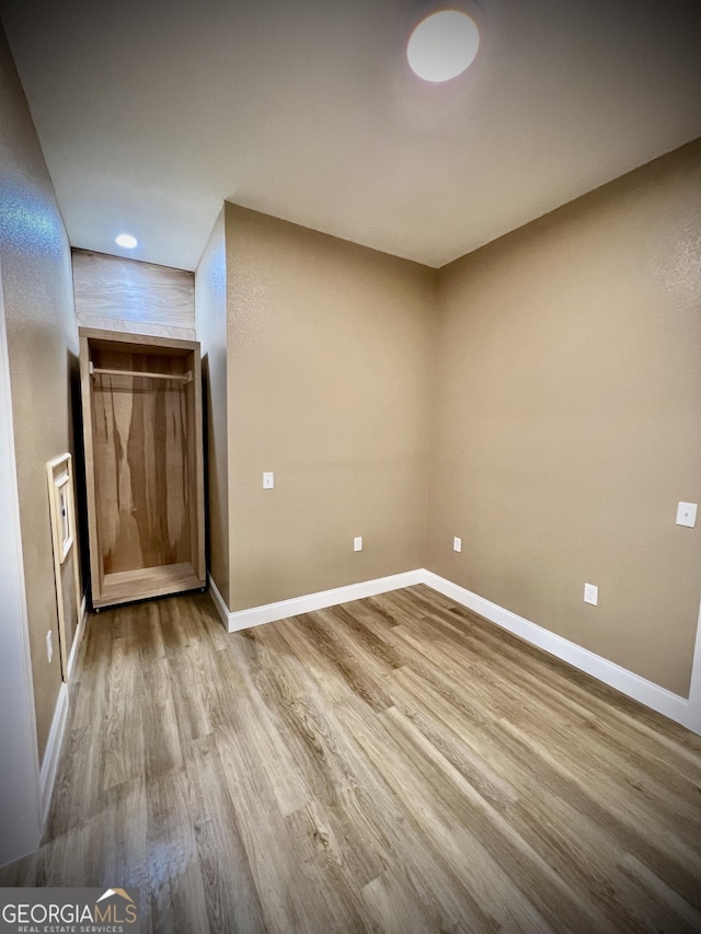 spare room featuring light hardwood / wood-style flooring