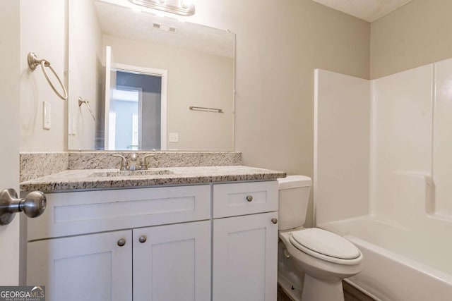 full bathroom featuring vanity, toilet, shower / bath combination, and a textured ceiling