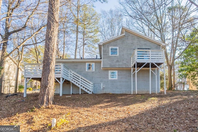 rear view of property with a wooden deck