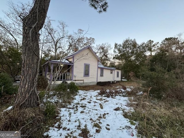 view of snow covered property