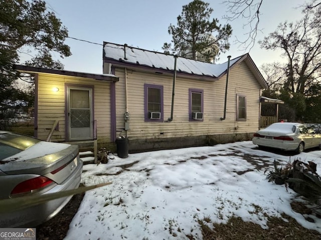 view of front of house featuring cooling unit