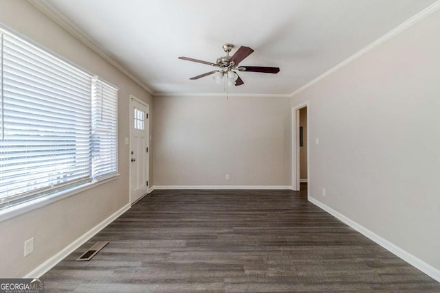 unfurnished room featuring dark wood-type flooring, ceiling fan, and ornamental molding