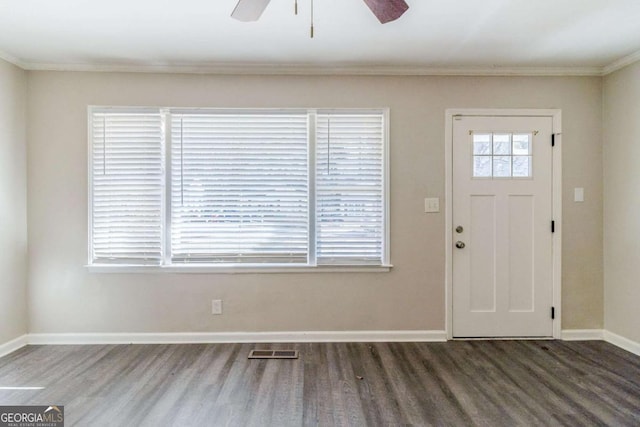 foyer with crown molding, dark hardwood / wood-style floors, and ceiling fan