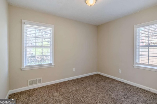 unfurnished room with carpet flooring