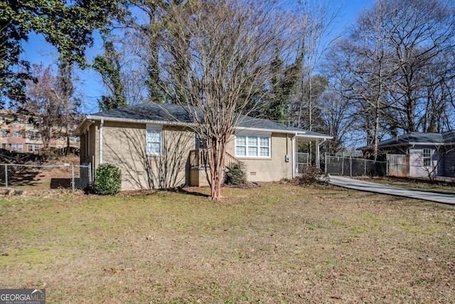 back of house with a lawn