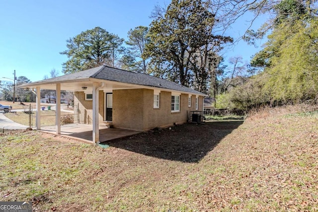 view of side of home featuring a patio