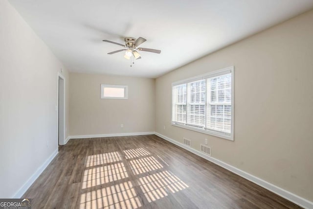 empty room featuring ceiling fan and wood-type flooring