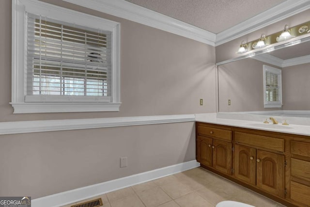 bathroom featuring crown molding, tile patterned floors, a textured ceiling, and vanity