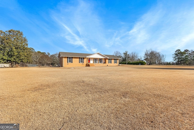 ranch-style home with a front yard