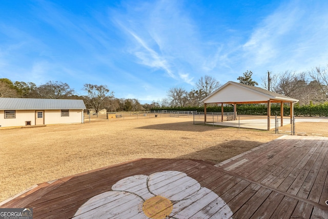 view of home's community with a rural view, a wooden deck, and a gazebo