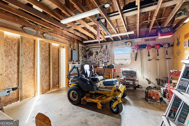 interior space featuring electric panel and a workshop area